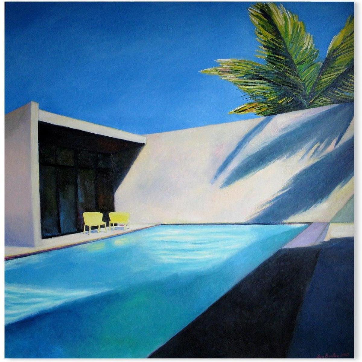 Pool and two yellow chairs